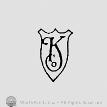 Letters K CO written on a shield.