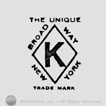 Letter K inside a diamond; words BROAD WAY NEW YORK written on the edge.