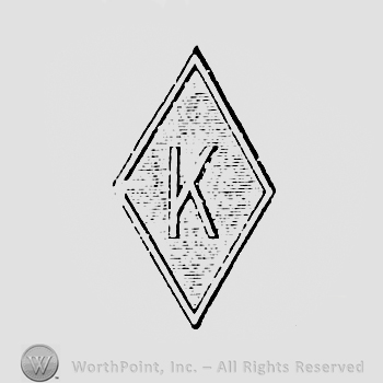 Letter K inside a diamond.