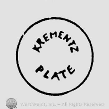 Words KREMENTZ PLATE written inside a circle.