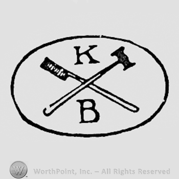 Letters KB and two tools, all inside a circle.