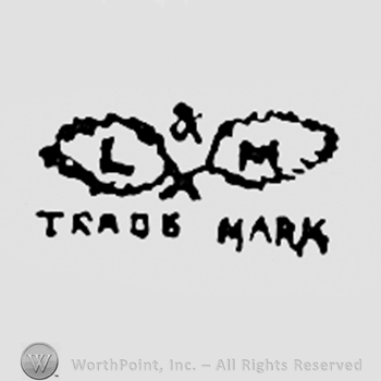 Letters L & M; TRADE MARK written bellow.