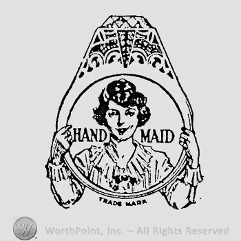 Woman with a huge ring; words HAND MADE written inside the ring.