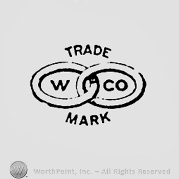 Two rings, letters W CO, and TRADE MARK written above and bellow.