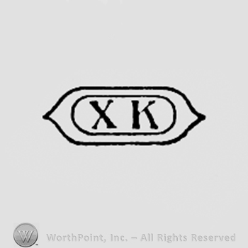 Letters XK written inside an oval.