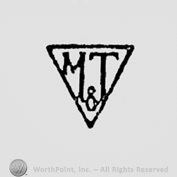 Letters M&T inside a triangle.