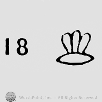 Number 18 and a shape like a flower.