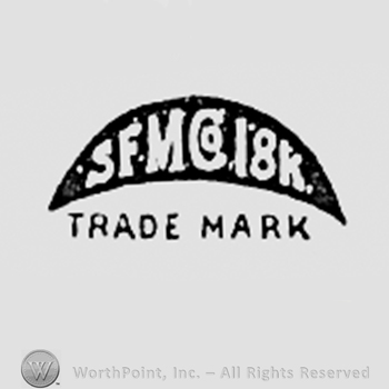 SFMCO 18K written inside a shape like a crescent.