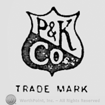 Letters P & K CO written on a shield.