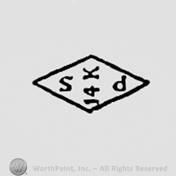 Letters S 14K P inside a diamond.