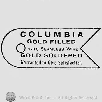 Words COLUMBIA GOLD FILLED SEAMLESS WIRE GOLD SOLDERED WARRANTED TO GIVE SATISFACTION.