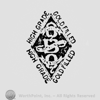 Letters QBQ  inside a black diamond; words HIGH GRADE GOLD FILLED written on the edge.