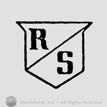 Letters R and S written on a shield.