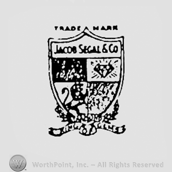 Words JACOB SEGAL & CO, and four pictures on a shiels; TRADE MARK written above and KING OF GEMS written bellow.