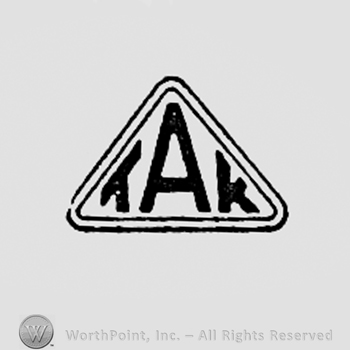 Letters TAK inside a triangle.