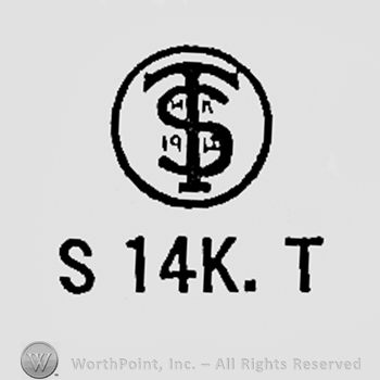 Monogram of letters T and S inside a circle; letter S 14k and T written bellow.