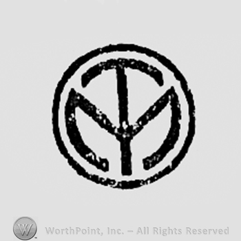 Monogram of letters M and T inside a circle.