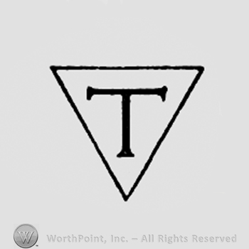 Letter T inside a triangle.