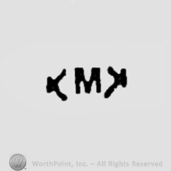 Letter M between two signs.