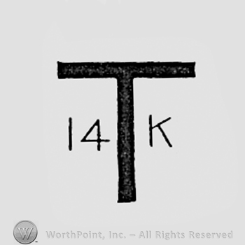 Letter T and 14K written smaller, one side and another.
