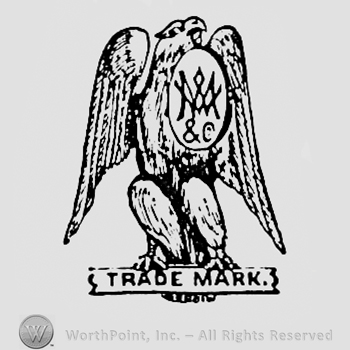 Letters on a shield; eagle above words TRADE MARK.