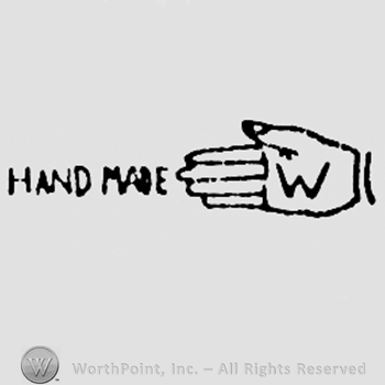 Letter W on a hand, and words HAND MADE written on the left.
