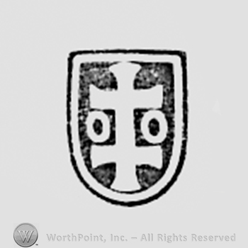 Two crosses and two circles inside a shield shape.