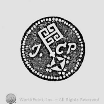 Key and letters JCP inside a circle.