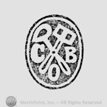 Tools and letters COB inside an oval.