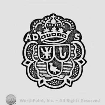 Bird, winged animal, letter J, crown above and letters AD S, all inside a floral subject.