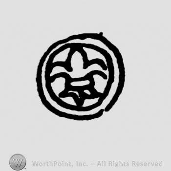 Fleur de lis inside a circle.