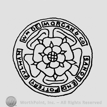 Circle with a flower In the middle;Wm De Morgan & Co Sands End Pottery Fulham written.