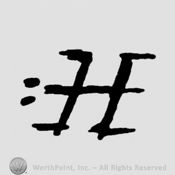 Letter H and two dots.
