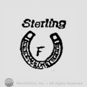 Horseshoe with Sterling F written.