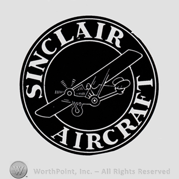 Plane inside a black circle; words SINCLAIR AIRCRAFT written on the edge.