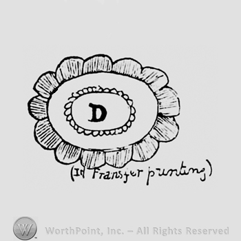 An oval flower with an uppercase D inside and above the words transfer painding