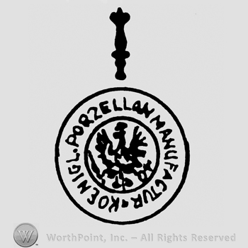 A scepter on top of an Eagle with a scepter,a crown and a cross inside a circle;Konigliche Porzellanmanufaktur written