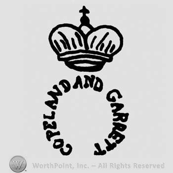 A crown with cross above COPELAND GARRETT roudn written.