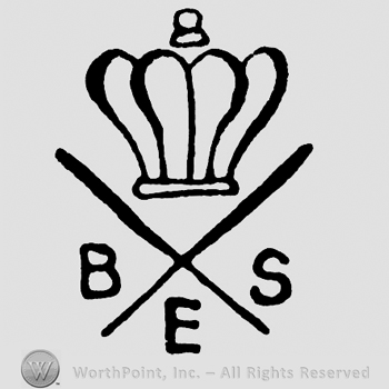 A crown on top of letters BES and a cross.