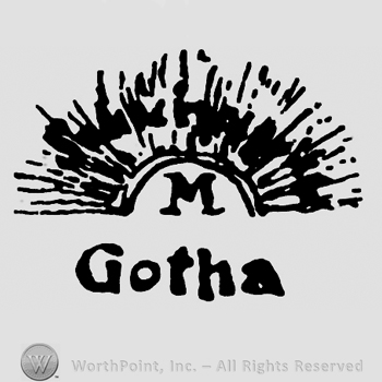 Shape similar with half of a sun;Letter M inside and word Gotha below.