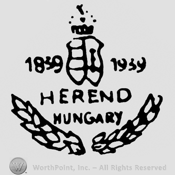 A crown and a shield in the middle;Herend Hungary below;1839 1939 on sides.