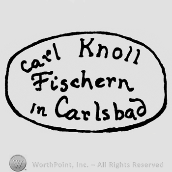 An oval with Carl Knoll Fischern in Carlsbad written inside.