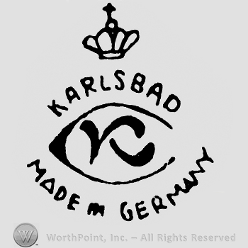 An oval with letter K in the middle;word Karlsbad and a crown on top;Made in Germany written below.
