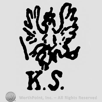 An eagle with a scepter and letters KS below.