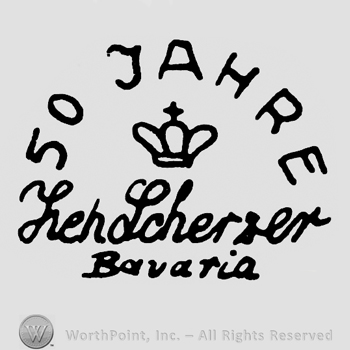 Crown with cross in the middle;50 Jahre written on top ;Zeh Scherzer Bavaria written below.