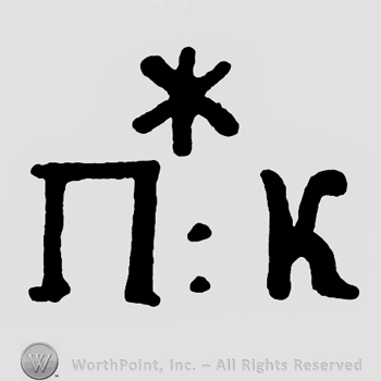 Asterisk and letters NK.