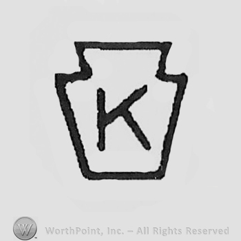 Capital letter "K" inside a bottle