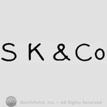 Letters "S K & Co"