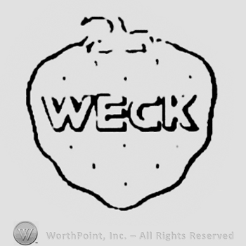 Capital letters "WECK" inside a strawberry
