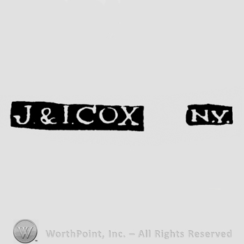 The letters J & I Cox written in uppercase